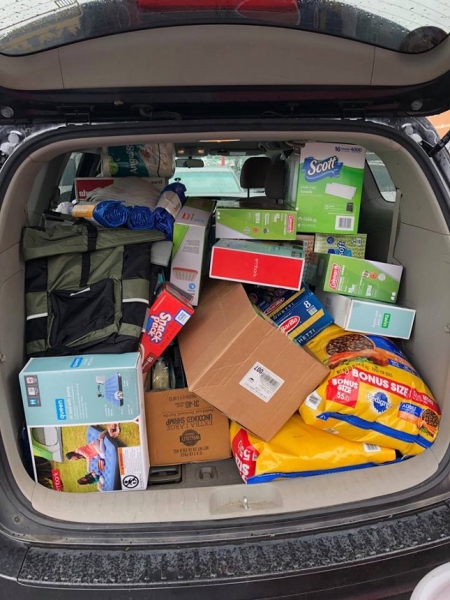 Car trunk filled with hurricane relief supplies.